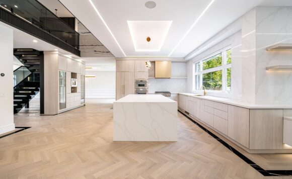 Open-riser staircase with smoked-glass railings in a luxury home at 2014 Lakeshore Rd W, Bronte Oakville.