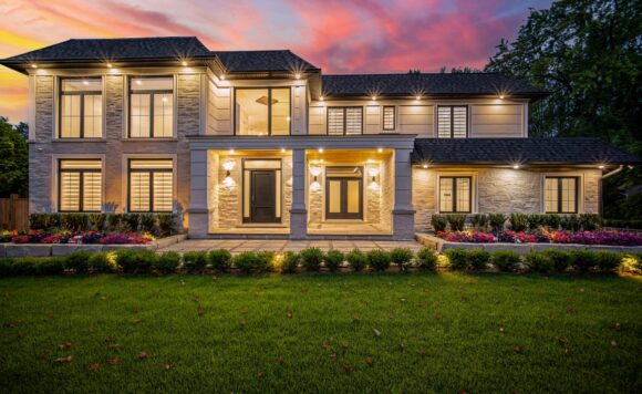 Twilight exterior of 2014 Lakeshore Rd W in Bronte, Oakville, a custom luxury home on Lakeshore Road West.