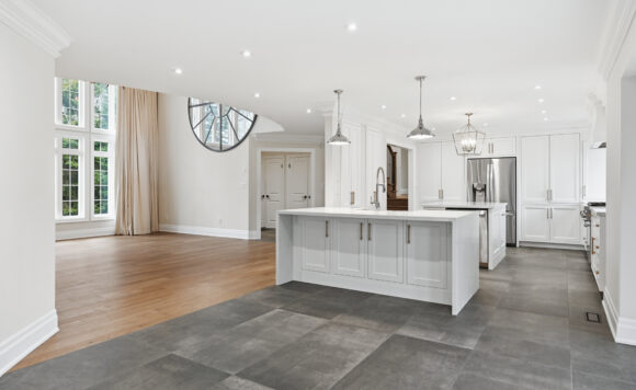 Custom kitchen at 1601 Venetia Drive Oakville with quartz countertops, centre prep island and Thermador gas range in Coronation Park