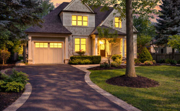 Twilight exterior of 1049 Cedar Grove Boulevard in Morrison Oakville featuring cedar shake siding and copper detailing – Roberto Ficzere listing