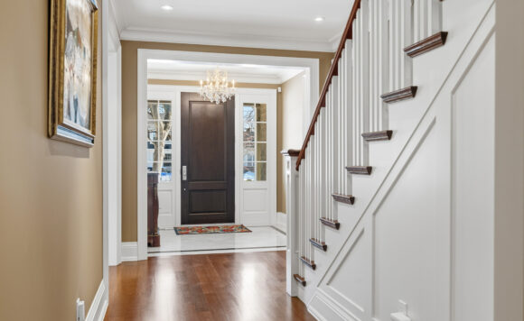 Interior foyer with limestone flooring and custom millwork at 1049 Cedar Grove Boulevard in Morrison Oakville